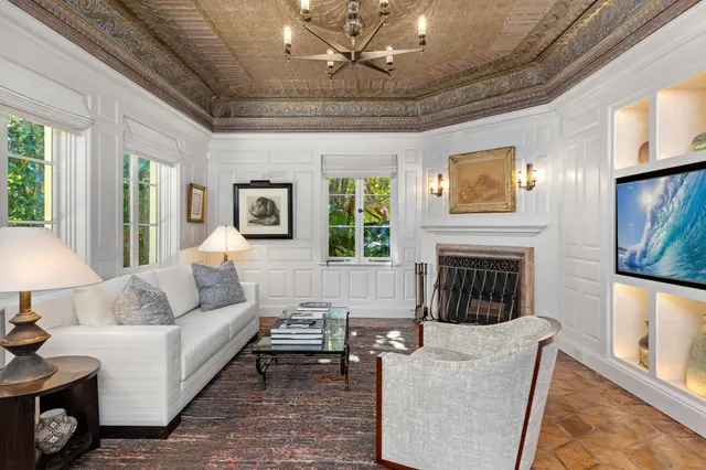 a spacious bedroom with a bed and a large window