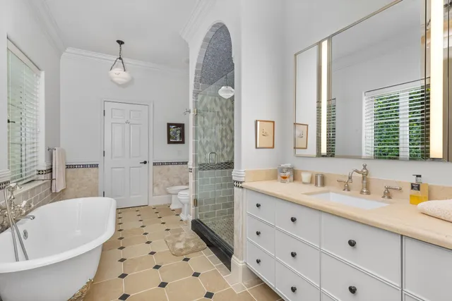 a spacious bedroom with a bed and a couch