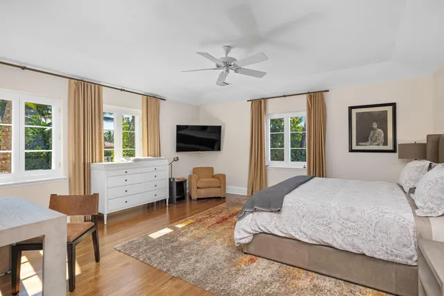 a bedroom with two beds and a chandelier