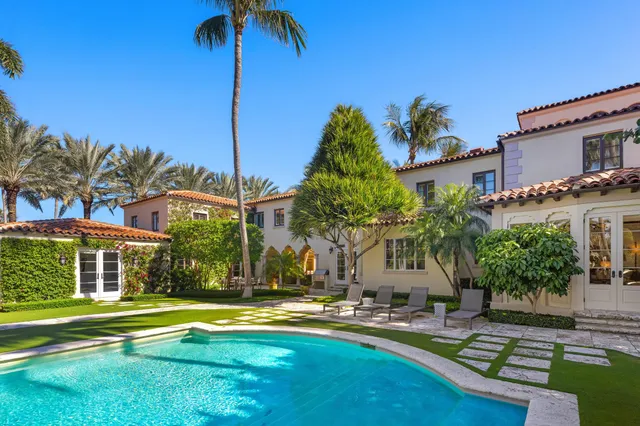 a view of a dining table and chairs in the patio