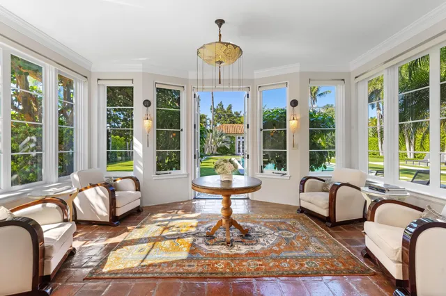 a kitchen with stainless steel appliances granite countertop a sink a stove and a wooden floors