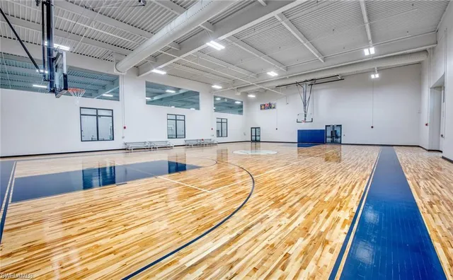 a room with pool table and windows
