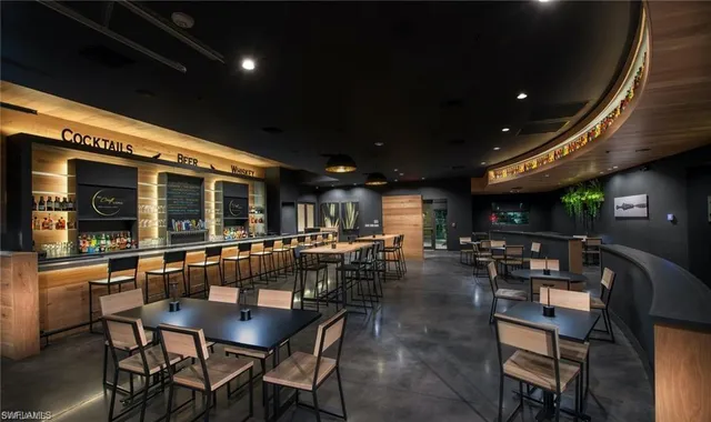 a kitchen with a table and chairs in it