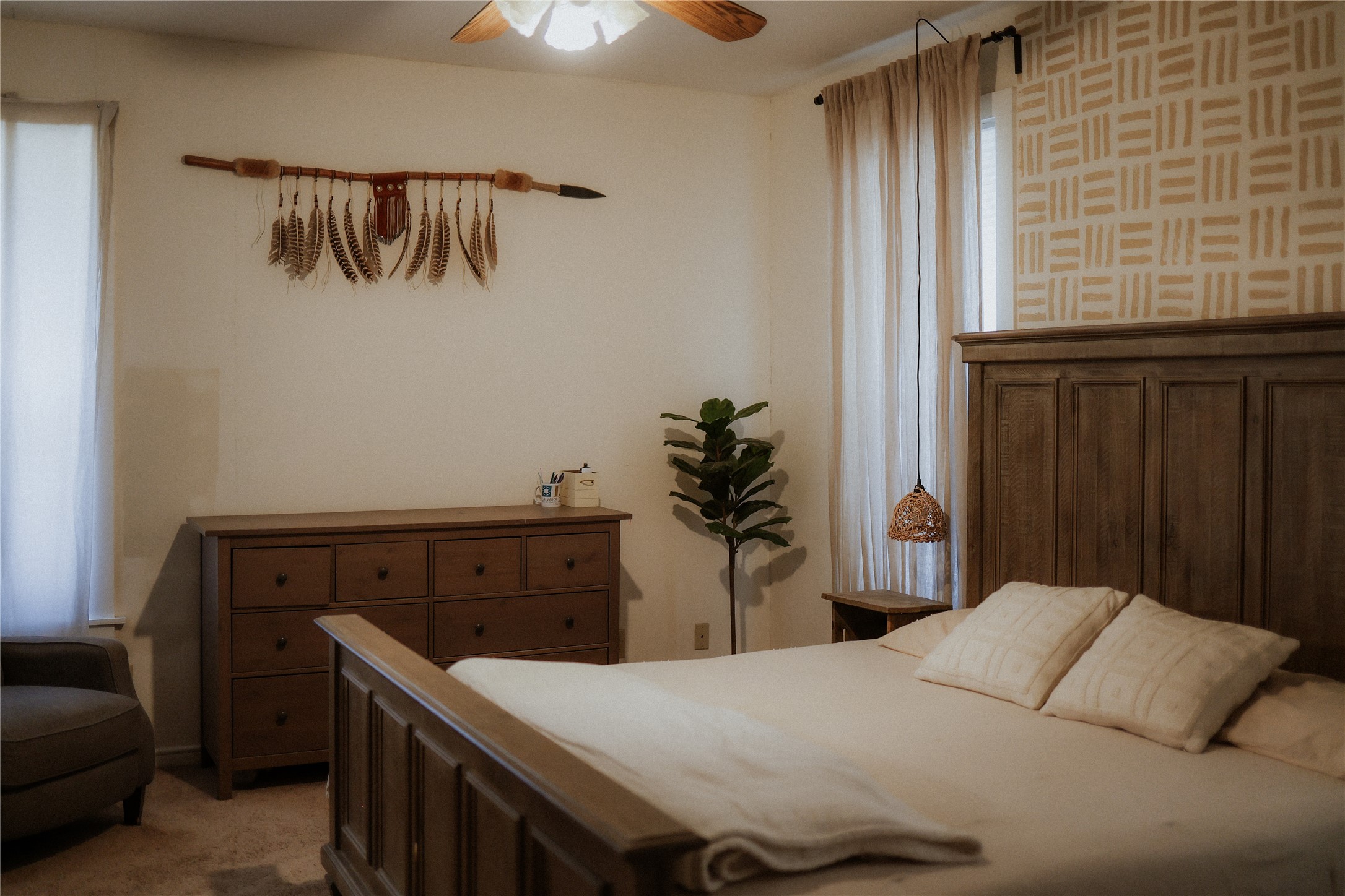 17323 Manda Carlson Road Manor, TX 78653 - Photo 15 of 29 Soft carpeting pairs with a patterned wall in this restful bedroom retreat.