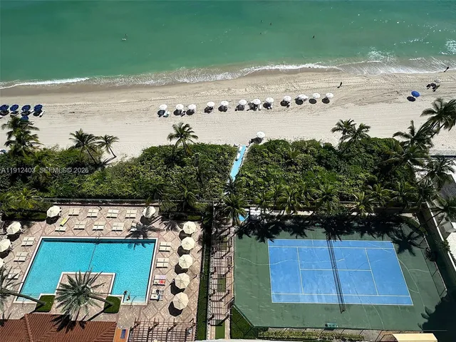 a view of two room with furniture and a window
