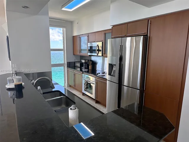 a bedroom with two beds and a window