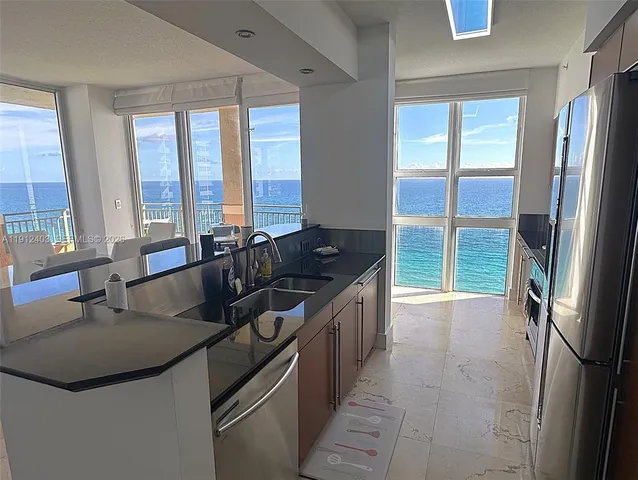 a bedroom with two beds and painting on the wall