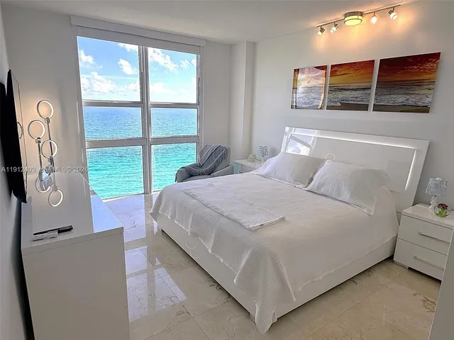a view of a swimming pool with a lounge chairs