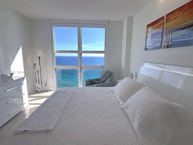a dining hall with lots of tables and chairs