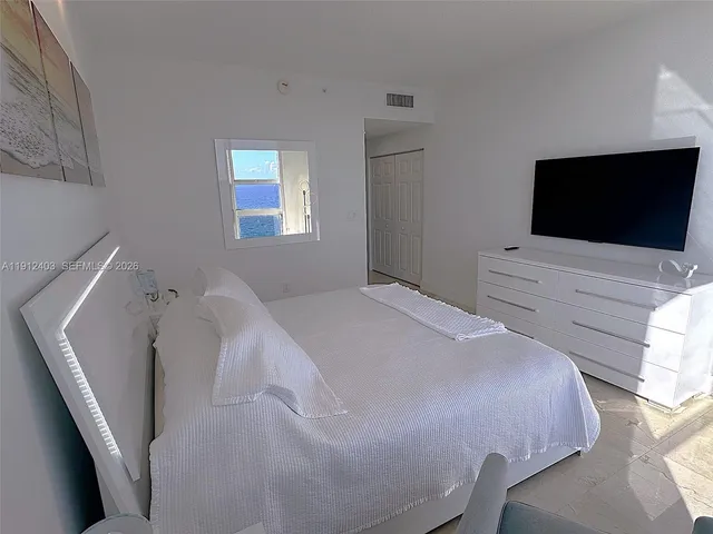 a room with gym equipment and a large window