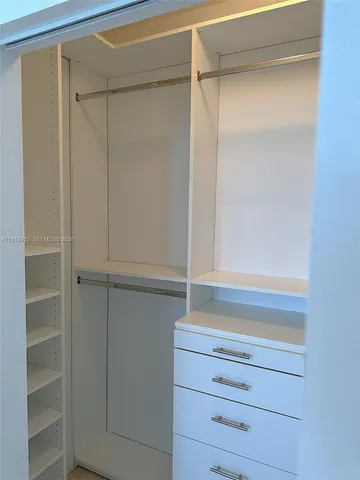 a room with gym equipment and a large window