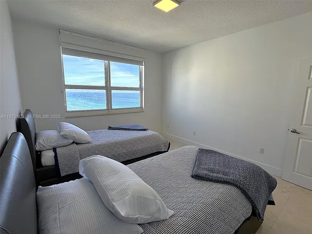 a view of a dining room with furniture and window