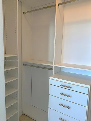 a view of parking garage with cars