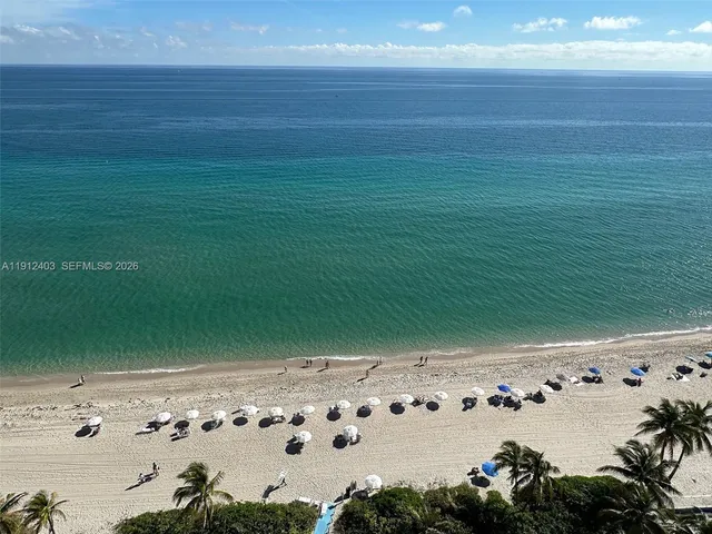a kitchen with kitchen island a counter top space appliances and a counter space