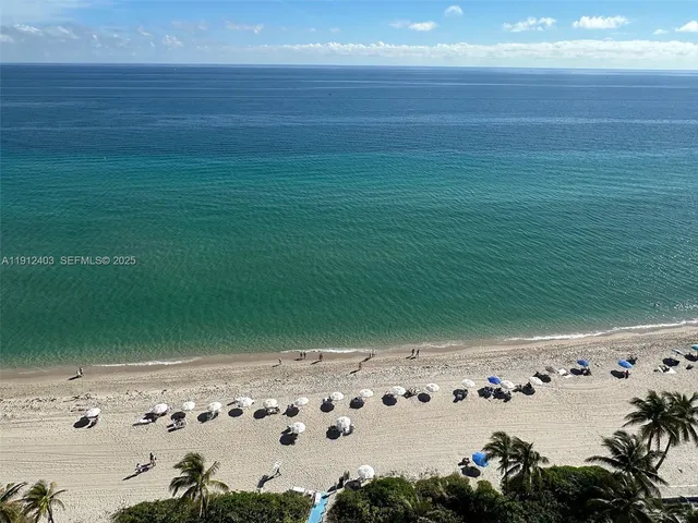 a kitchen with stainless steel appliances granite countertop a sink and a microwave