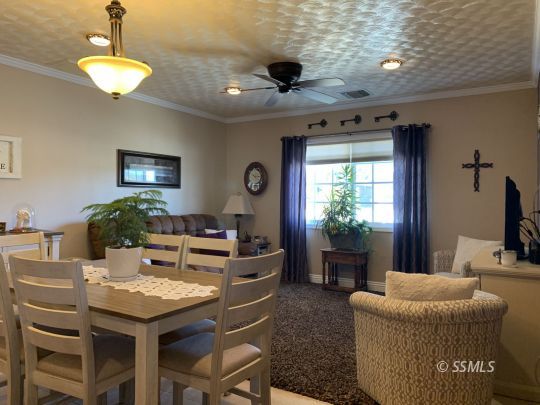 1320 Mayo Street Ridgecrest, CA 93555 - Photo 9 of 45 a view of a dining room with furniture window and outside view