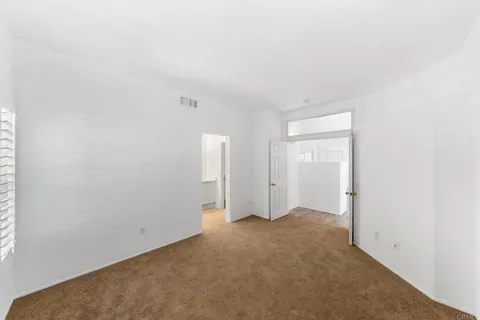 a bed room with a bed and a television