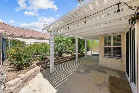 a view of a patio with wooden floor