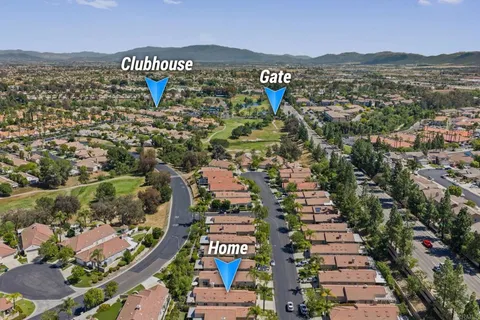 an aerial view of residential houses and outdoor space