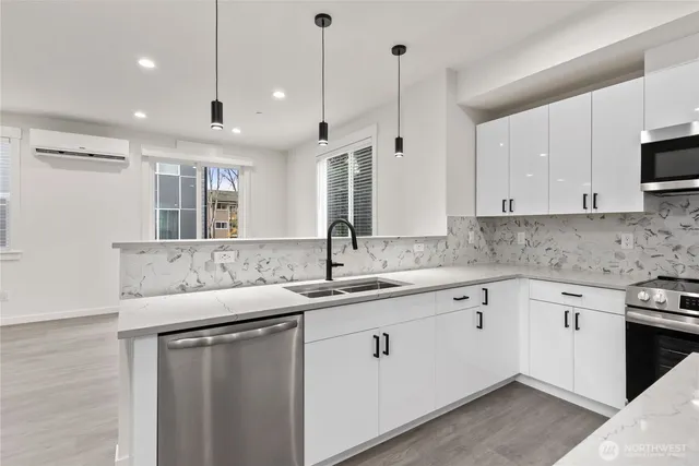 a kitchen with a sink stove and cabinets