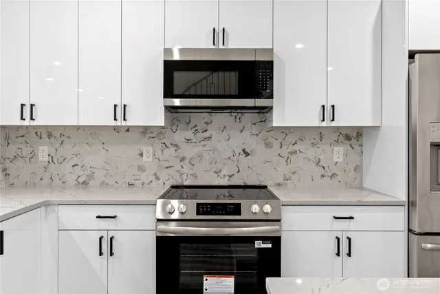 a kitchen with a stove and a microwave