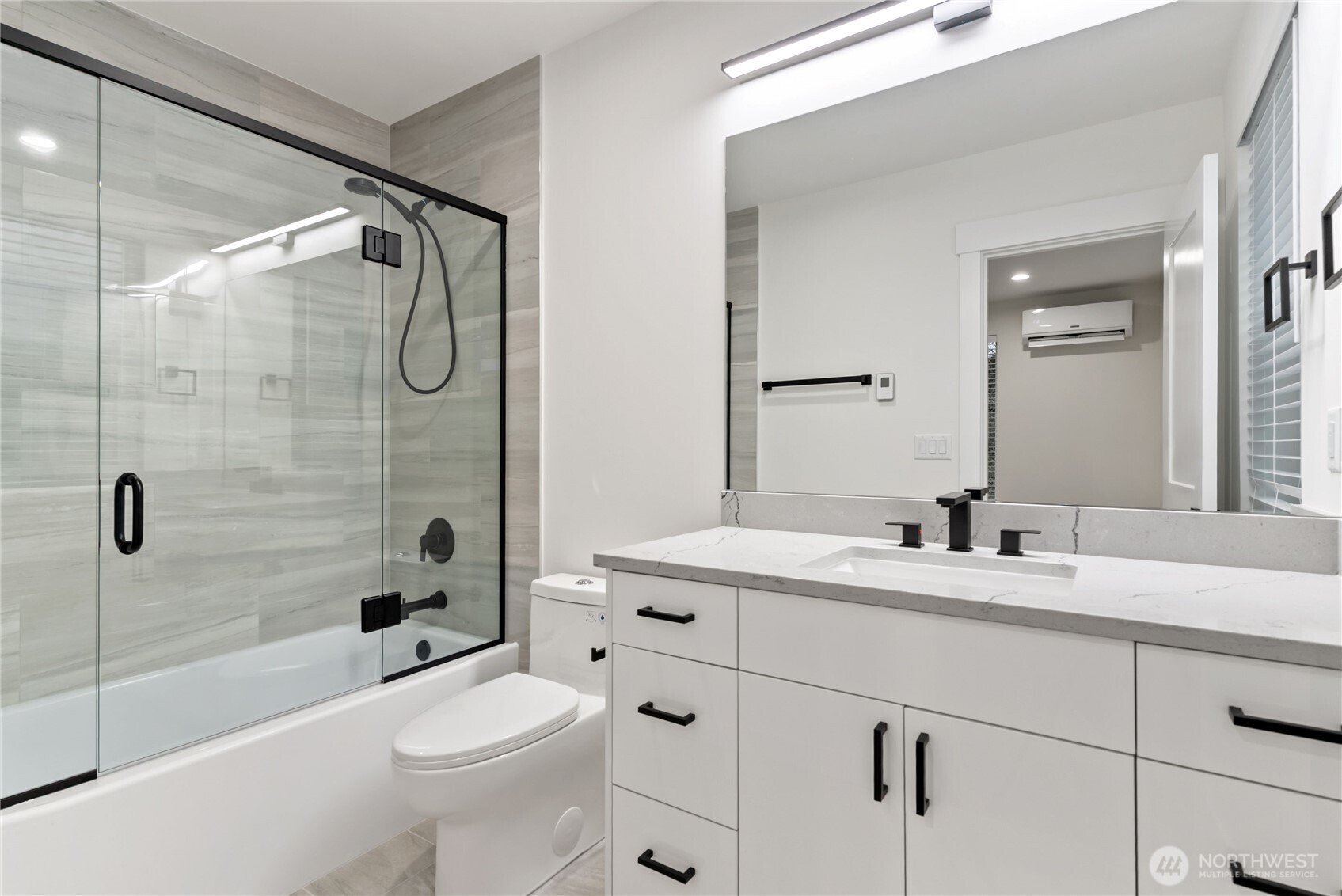 1926 South Washington Street, Unit B206 Tacoma, WA 98405 - Photo 26 of 39 a bathroom with a sink a toilet and shower