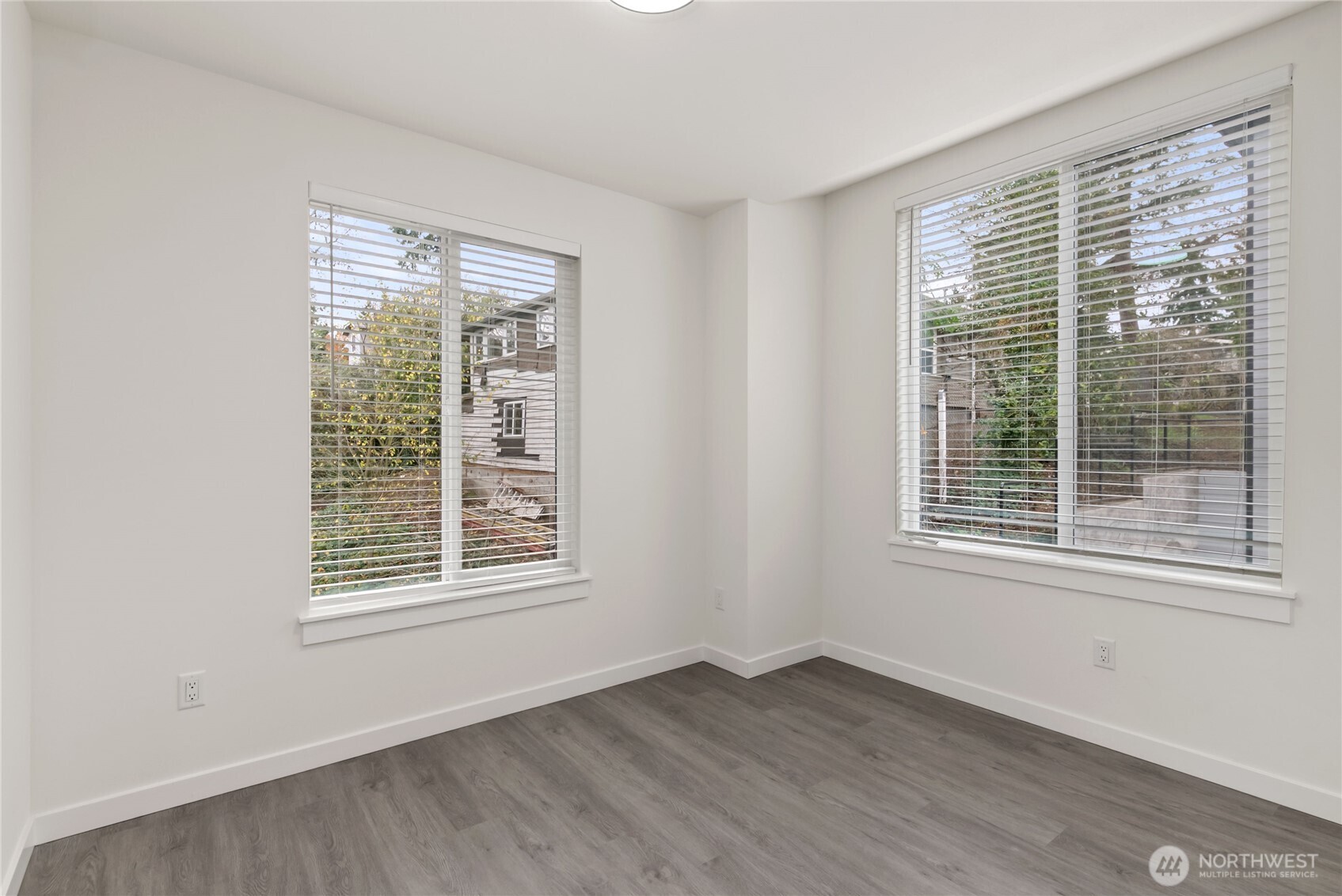 1926 South Washington Street, Unit B206 Tacoma, WA 98405 - Photo 28 of 39 a view of an empty room with wooden floor and a window
