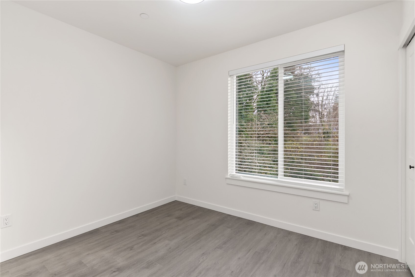 1926 South Washington Street, Unit B206 Tacoma, WA 98405 - Photo 30 of 39 a view of an empty room with wooden floor and a window