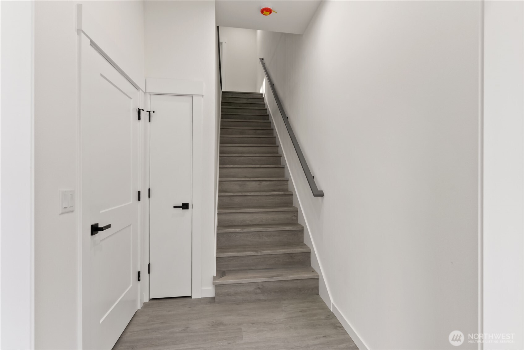 1926 South Washington Street, Unit B206 Tacoma, WA 98405 - Photo 7 of 39 a view of a hallway with staircase