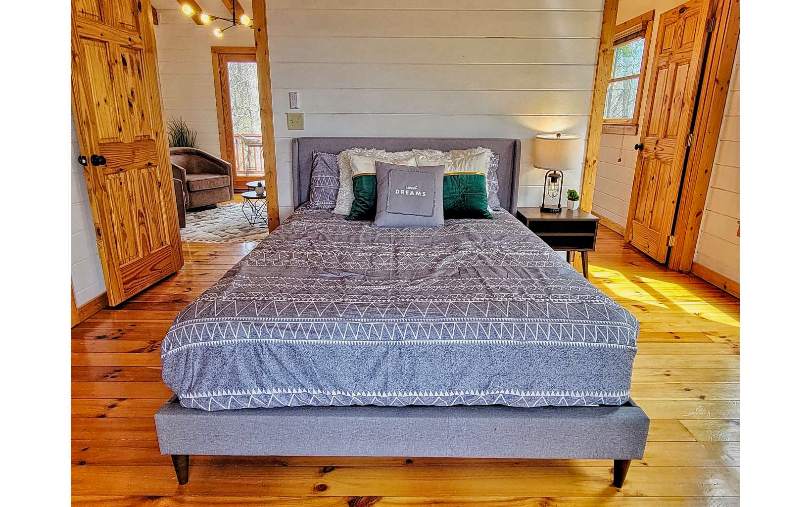 360 Tall Timber Mountain Road Blue Ridge, GA 30513 - Photo 27 of 52 a bedroom with a bed and wooden floor