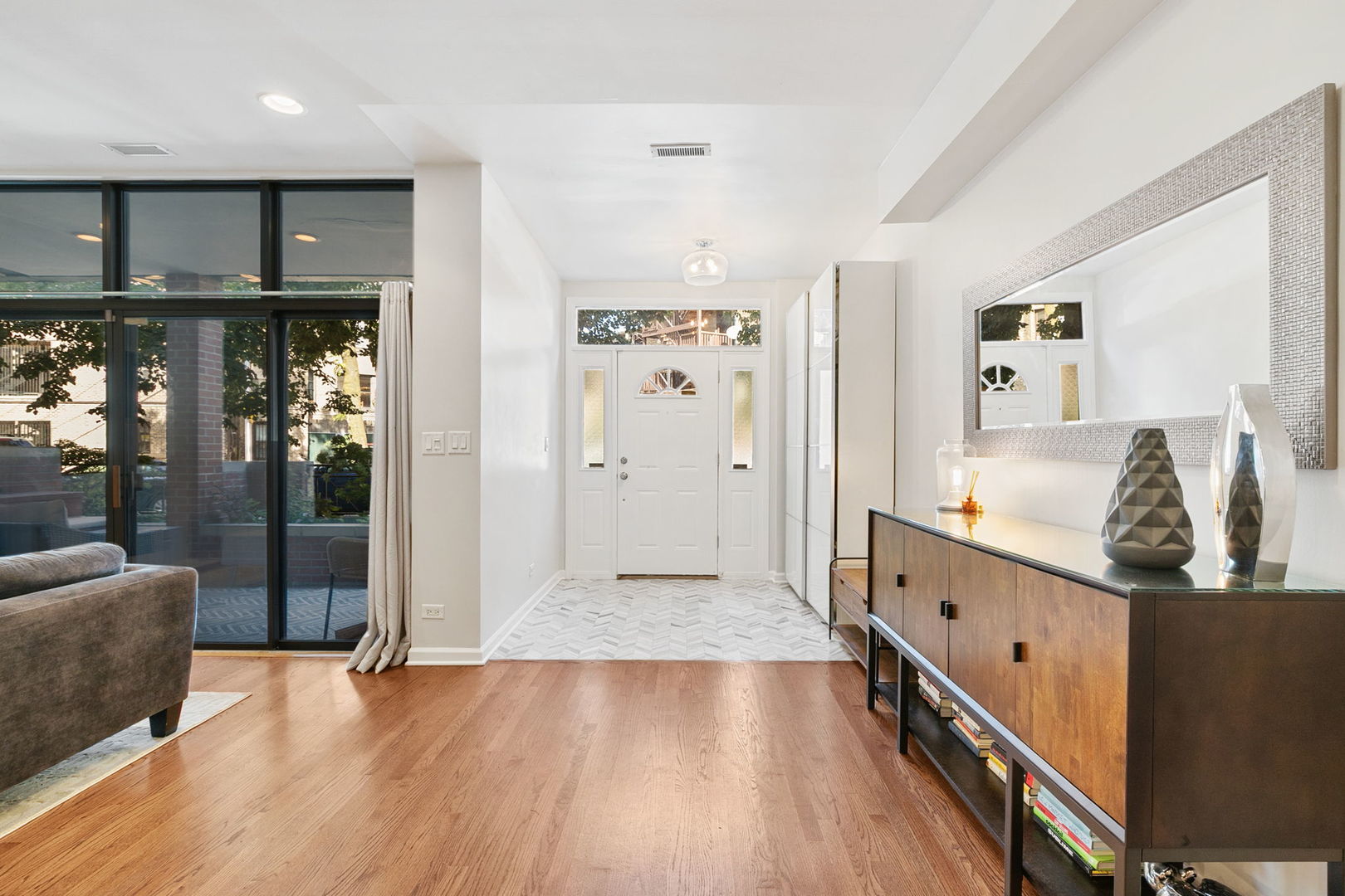 2518 North Willetts Court, Unit GS Chicago, IL 60647 - Photo 7 of 34 a hallway with wooden floor and staircase