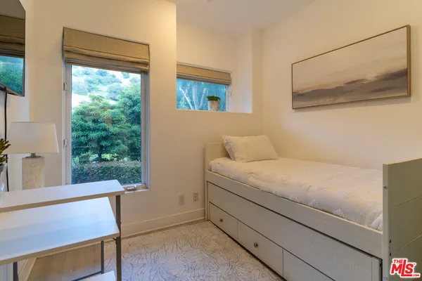 a room with a bed and a window