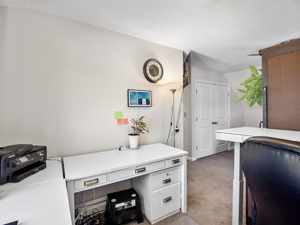 27 Riley Road, Unit 27 Tyngsborough, MA 01879 - Photo 23 of 37 a view of kitchen with white cabinets and wooden floor