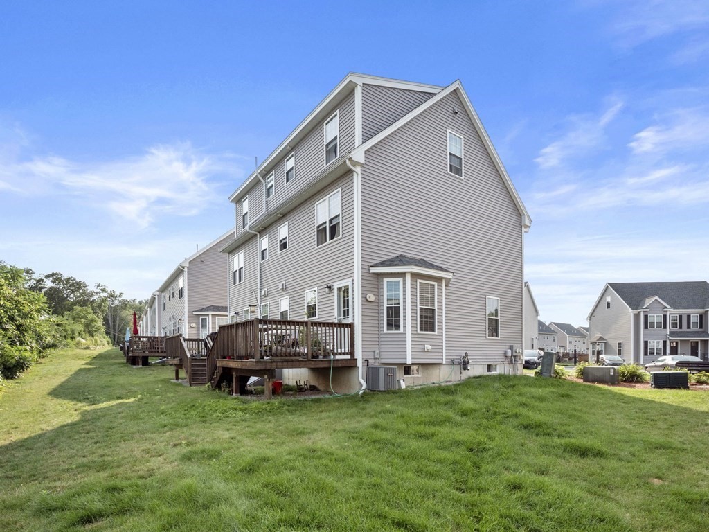 27 Riley Road, Unit 27 Tyngsborough, MA 01879 - Photo 34 of 37 a view of a house with a big yard