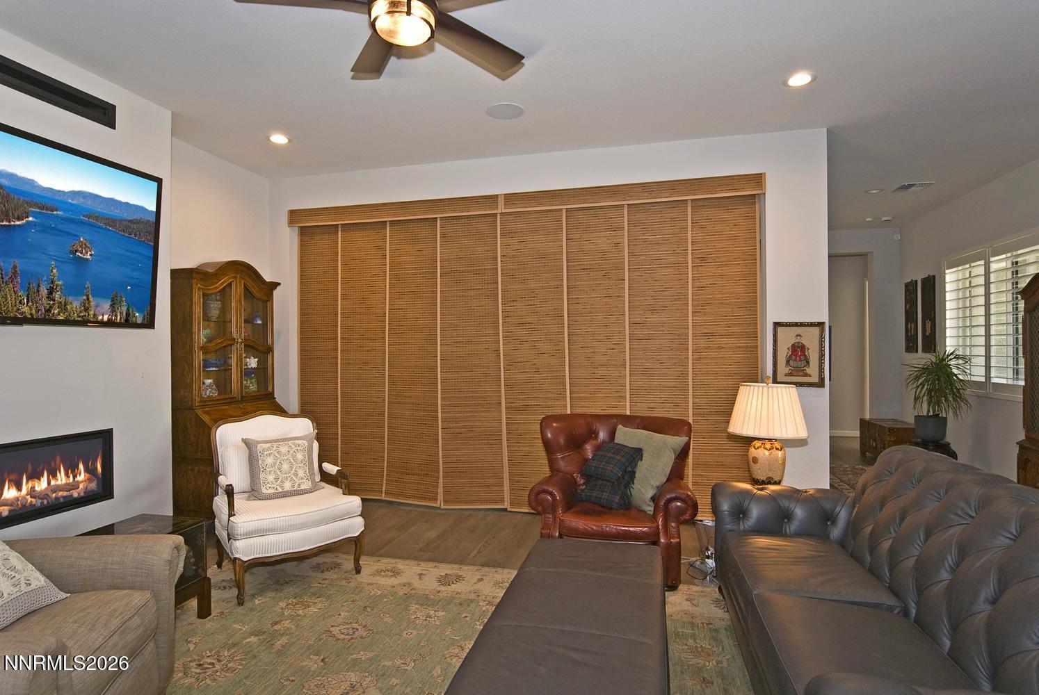 2332 Hammer Falls Drive Reno, NV 89521 - Photo 14 of 57 a living room with furniture and a lamp