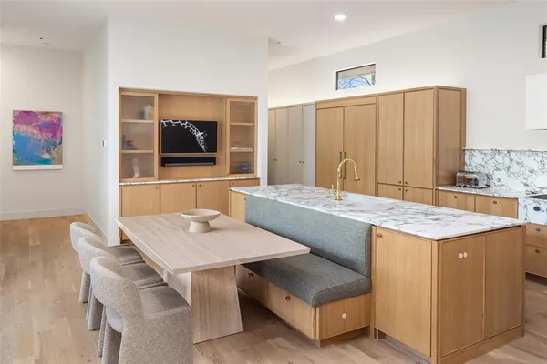a kitchen with a table and chairs