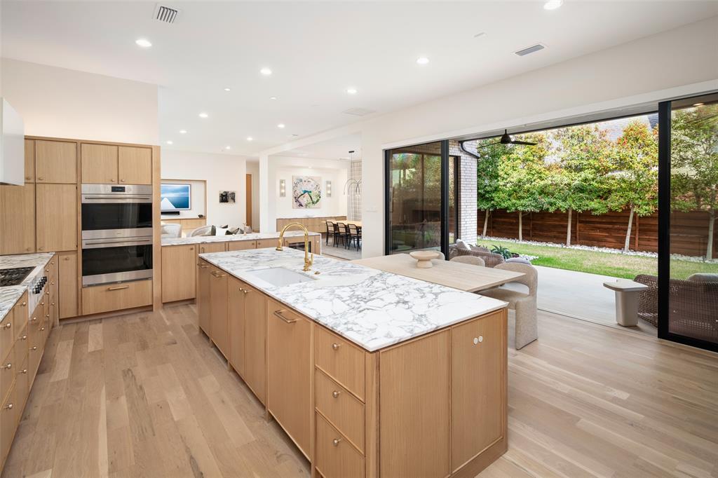 5000 Hanover Avenue Dallas, TX 75209 - Photo 15 of 36 a large kitchen with kitchen island a large counter top space appliances and cabinets