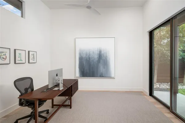 a workspace with a table and chairs