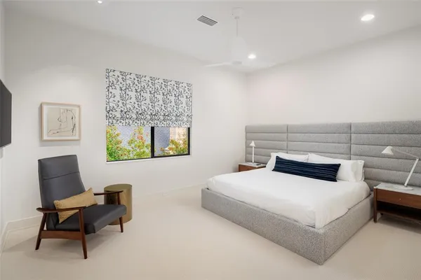 a bedroom with a bed and a couch