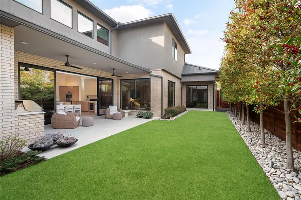 a view of a house with backyard porch and sitting area