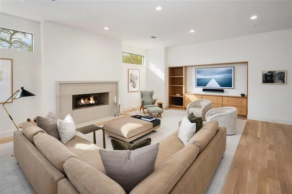 a living room with furniture and a fireplace