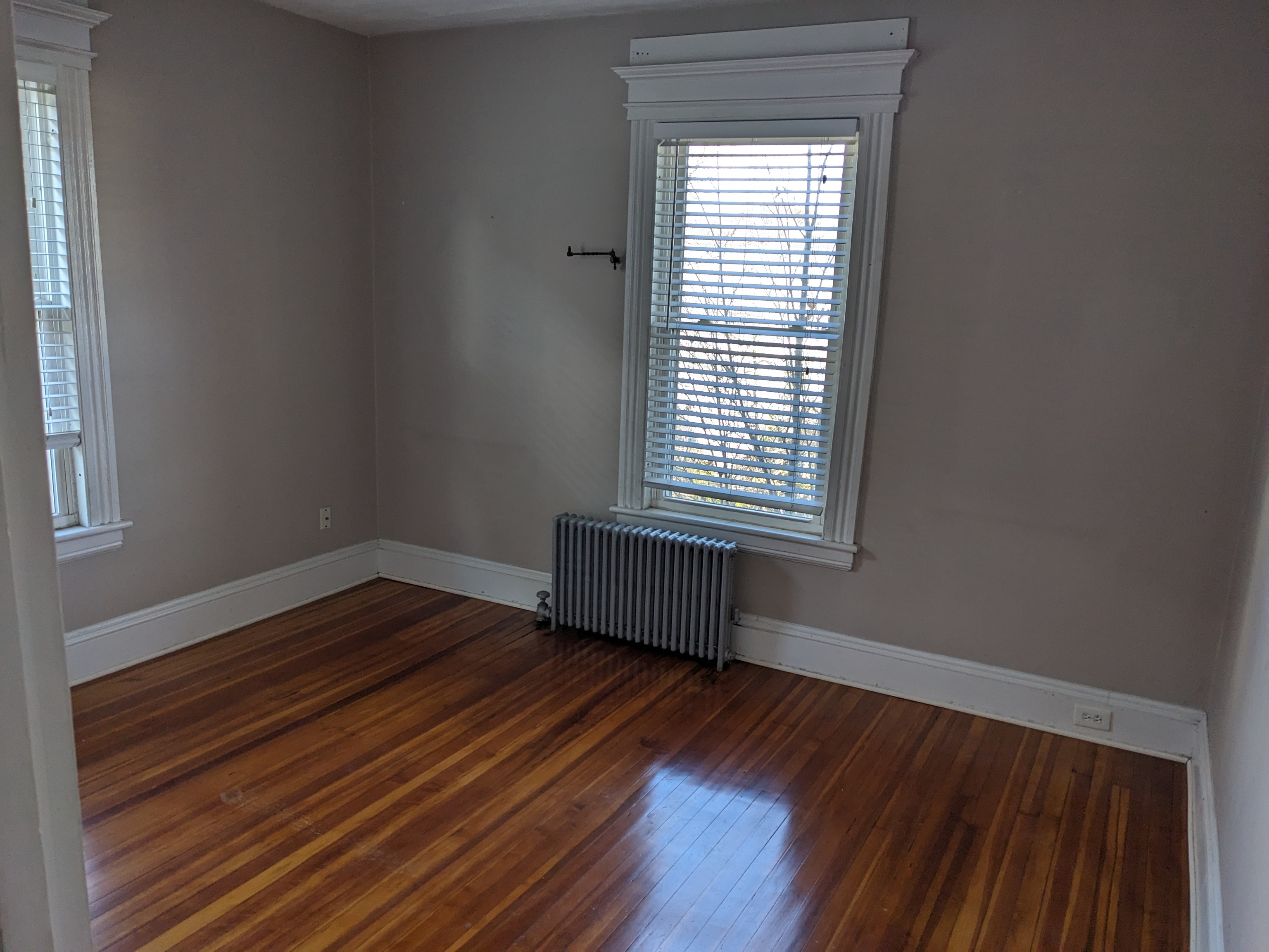 2870 Fairfield Avenue, Unit 2 Bridgeport, CT 06605 - Photo 7 of 15 a room with a window and wooden floor