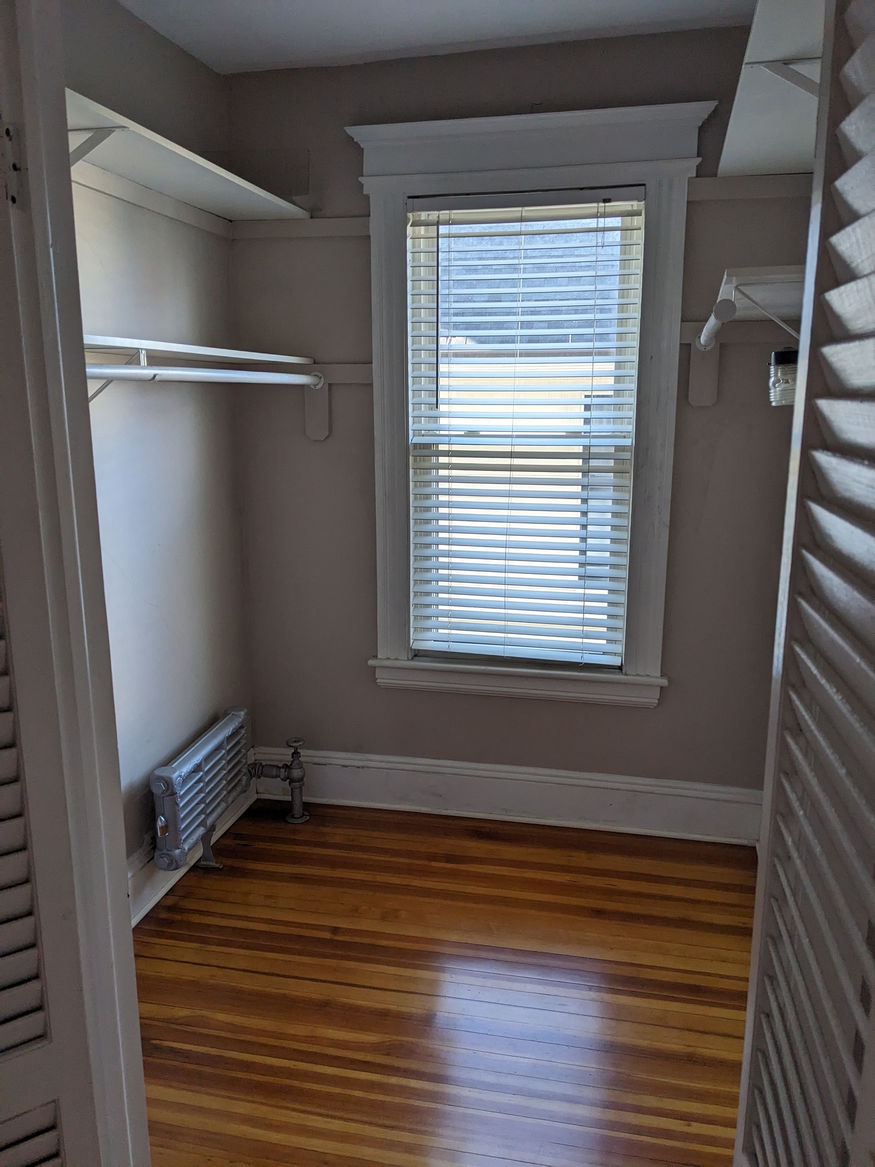 2870 Fairfield Avenue, Unit 2 Bridgeport, CT 06605 - Photo 9 of 15 a view of a room with wooden floor and windows