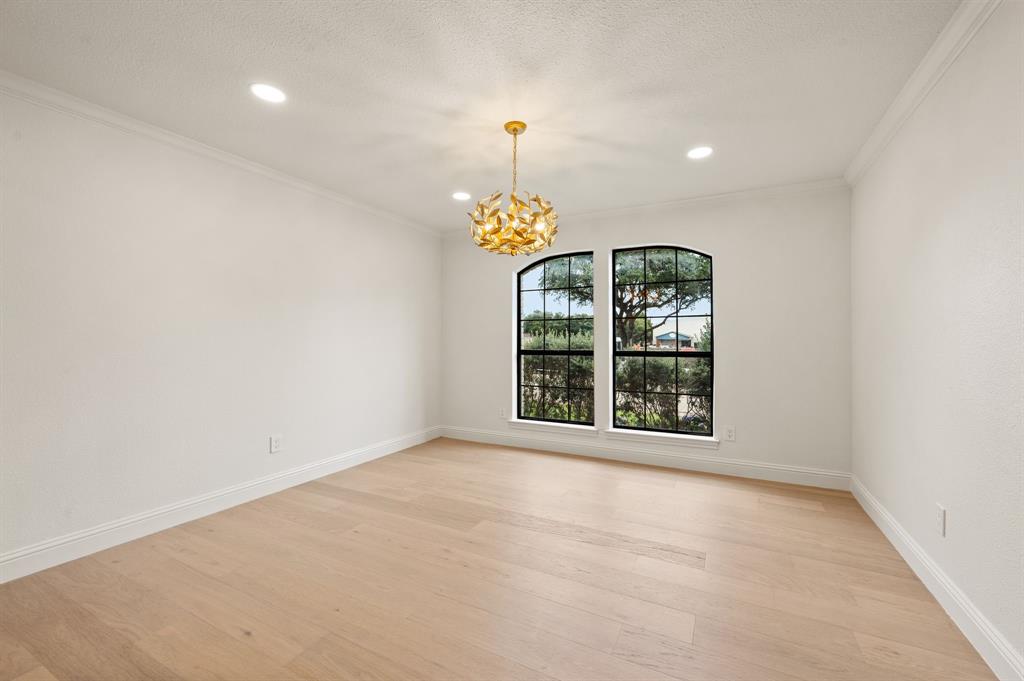 6403 Genstar Lane Dallas, TX 75252 - Photo 6 of 34 Spacious dining room with light wood-finish flooring, recessed lighting, and a contemporary gold-toned chandelier