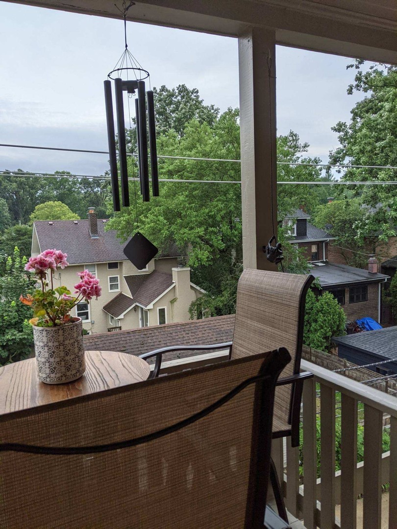 2238 Central Street, Unit 3 Evanston, IL 60201 - Photo 16 of 20 a view of a balcony with chairs and a potted plant