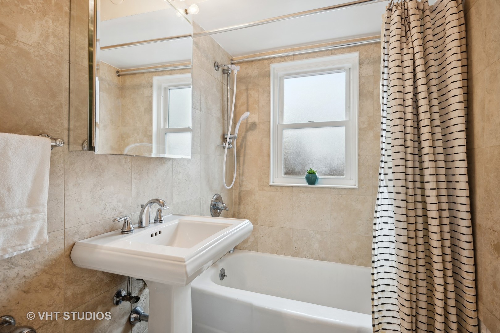 2238 Central Street, Unit 3 Evanston, IL 60201 - Photo 6 of 20 a bathroom with a sink a bathtub and a shower