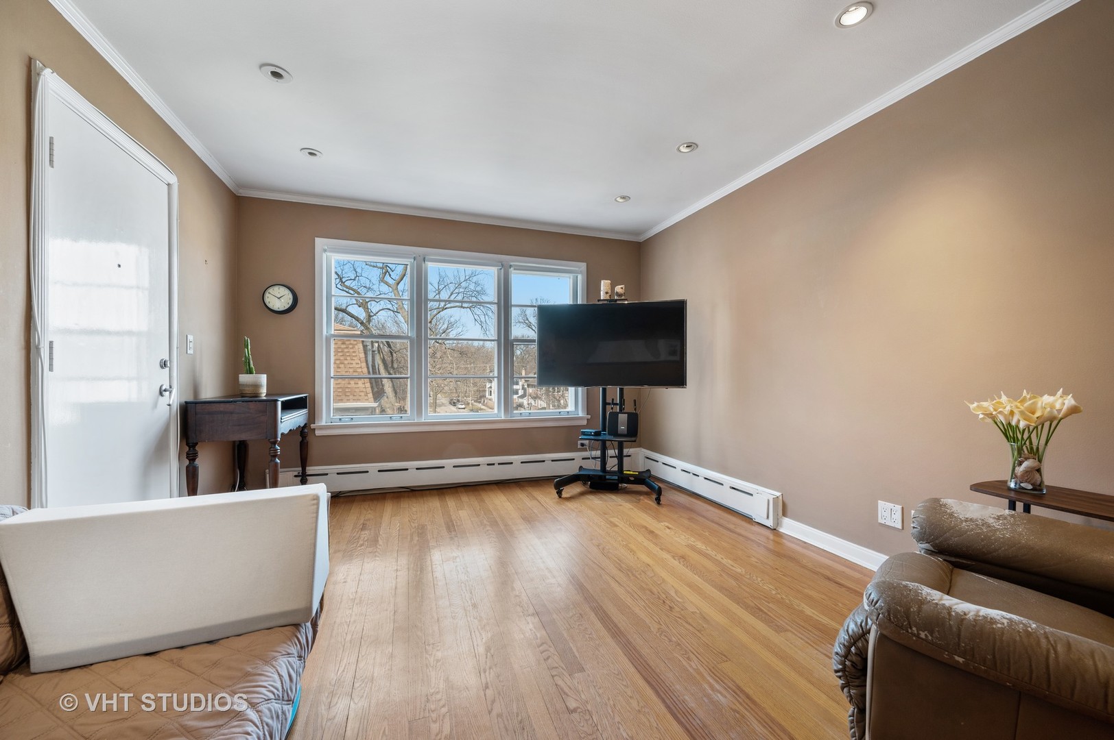 2238 Central Street, Unit 3 Evanston, IL 60201 - Photo 7 of 20 a living room with furniture and a window