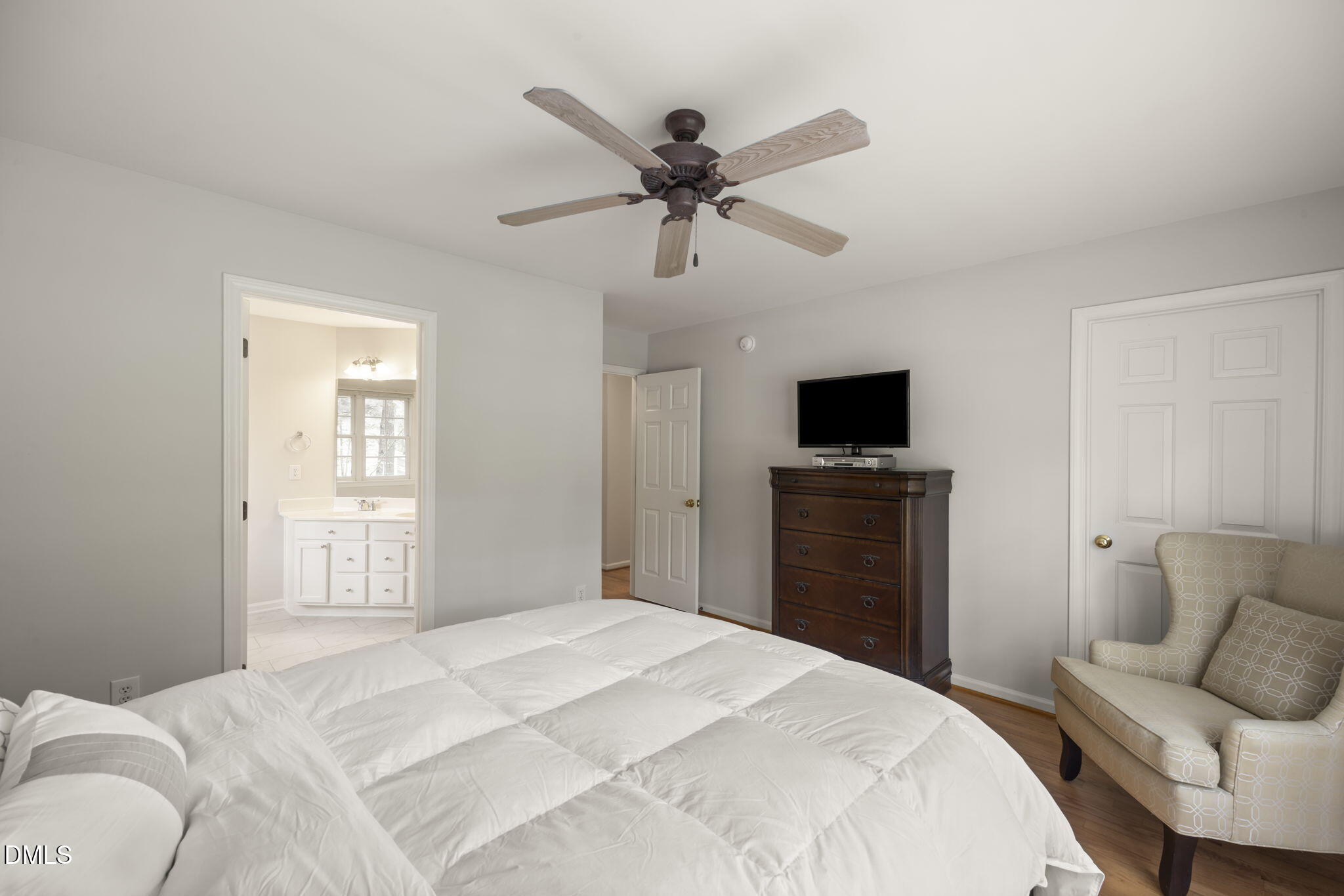 1008 Scotts Ridge Trail Apex, NC 27502 - Photo 32 of 57 a bedroom with a bed and a flat screen tv
