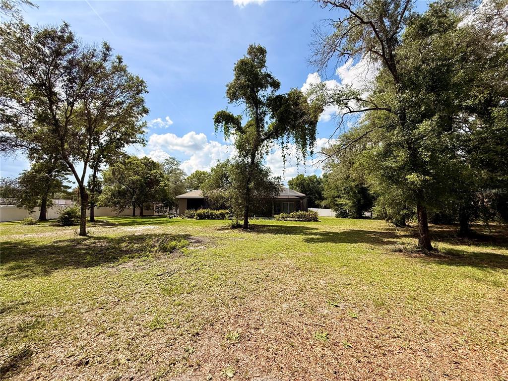 13110 Bamboo Street Spring Hill, FL 34609 - Photo 49 of 56 a view of a swimming pool with an outdoor space