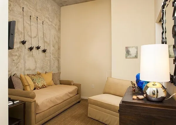 a bedroom with a bed and a couch